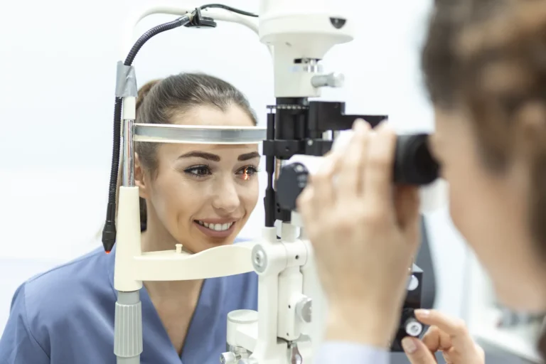 Ophthalmologist examining a patient's eyes with a slit lamp