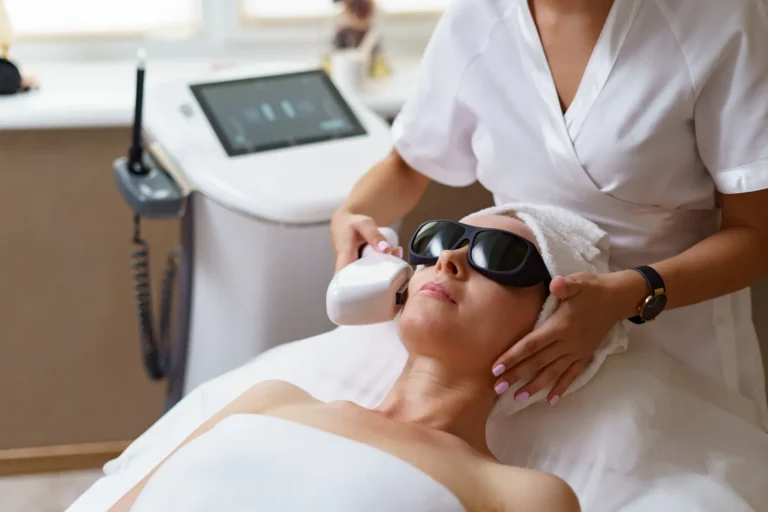 Relaxed patient receives a skin-tightening device treatment