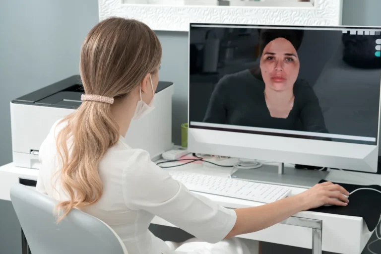 Specialist reviews a patient's digital facial scan on screen